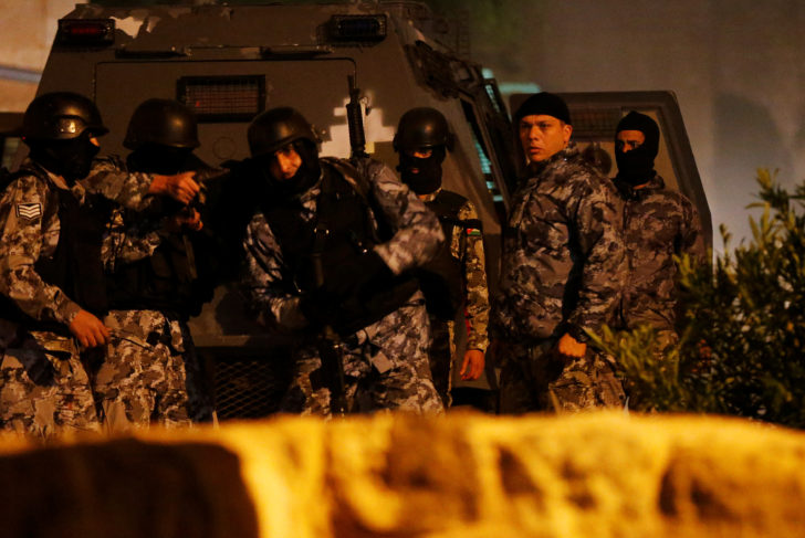 Jordanian policemen operate in the vicinity of Karak Castle, where armed gunmen carried out an attack, in the city of Karak, Jordan