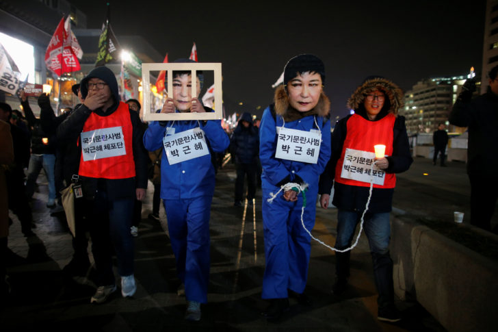 People march during a protest calling for South Korean President Park Geun-hye to step down in central Seoul