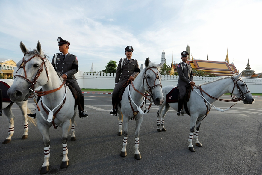 Thai policemen on horseback look on outside Grand Palace in Bangkok, Thailand, December 1, 2016. REUTERS/Jorge Silva