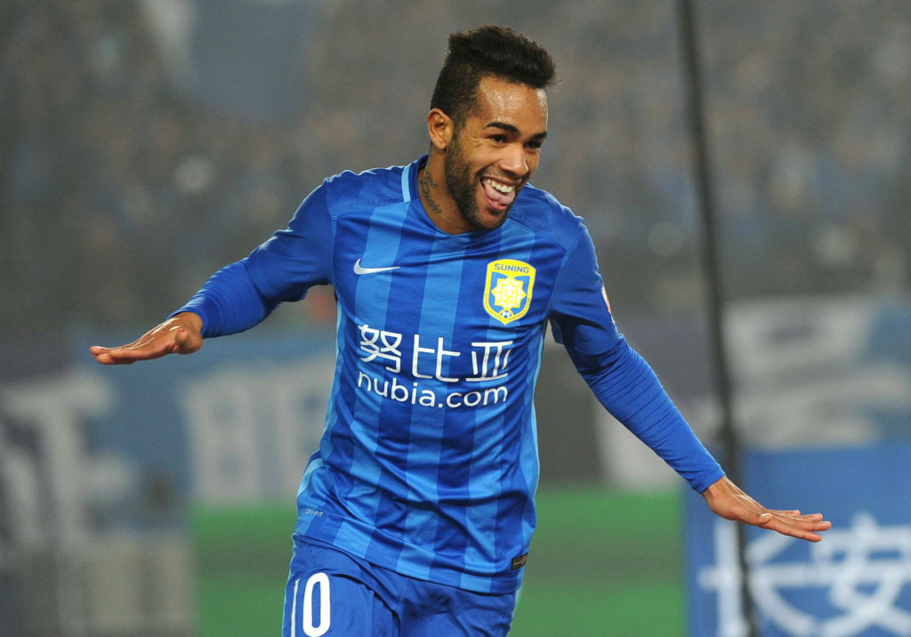 Jiangsu Suning's Alex Teixeira celebrates during the Chinese Super League football between Jiangsu Suning and Shandong Luneng on March 5, 2016 in Nanjing. / AFP / STR (Photo credit should read STR/AFP/Getty Images)