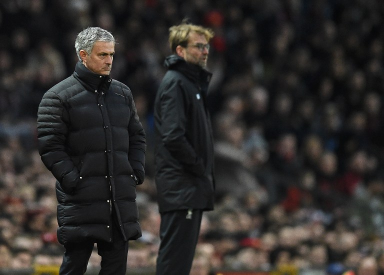 Manchester United's Portuguese manager Jose Mourinho (L) an Liverpool's German manager Jurgen Klopp watch the players from the touchline during the English Premier League football match between Manchester United and Liverpool at Old Trafford in Manchester, north west England, on January 15, 2017. / AFP PHOTO / Oli SCARFF / RESTRICTED TO EDITORIAL USE. No use with unauthorized audio, video, data, fixture lists, club/league logos or 'live' services. Online in-match use limited to 75 images, no video emulation. No use in betting, games or single club/league/player publications. /