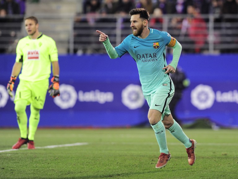 Barcelona's Argentinian forward Lionel Messi celebrates after scoring his team's second goal during the Spanish league football match SD Eibar vs FC Barcelona at the Ipurua stadium in Eibar on January 22, 2017. / AFP PHOTO / ANDER GILLENEA