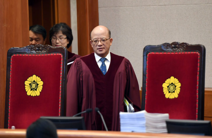 South Korean Constitutional Court's Chief Judge Park Han-Chul attends a hearing on whether to confirm the impeachment of President Park Geun-Hye, at the Court in Seoul