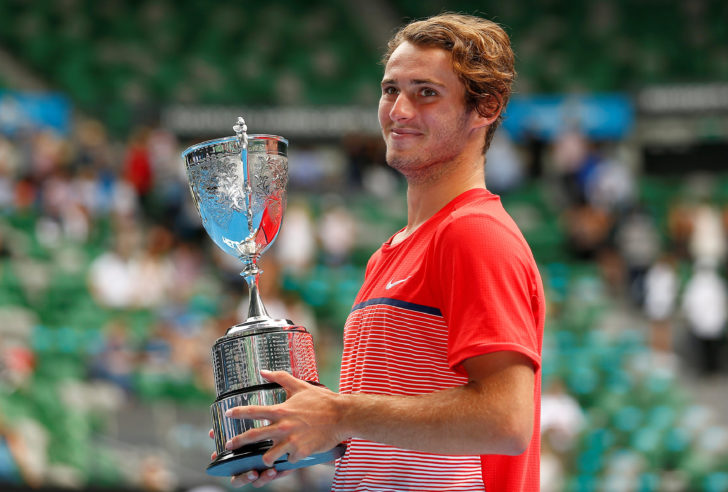 FILE PHOTO - Australia's Anderson poses with his trophy after winning his Junior Boys' Singles final match against Uzbekistan's Karimov at the Australian Open tennis tournament at Melbourne Park