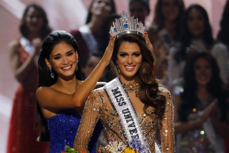 Pia Wurtzbach places the Miss Universe crown on Miss France Iris Mittenaere after the latter was declared winner in the Miss Universe beauty pageant at the Mall of Asia Arena, in Pasay, Metro Manila