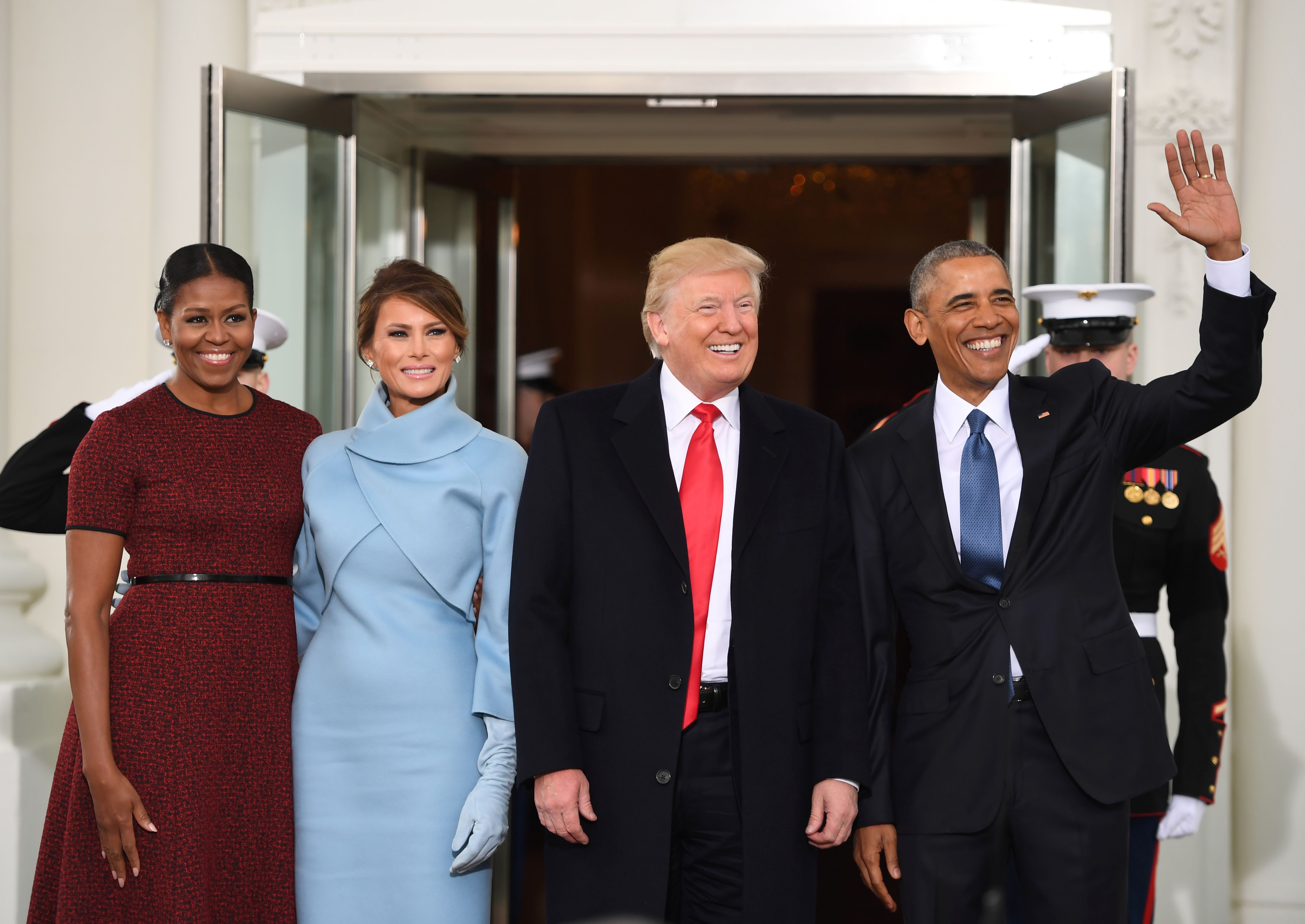 US President Barack Obama(R) and First Lady Michelle Obama(L) welcome Preisdent-elect Donald Trump(2nd-R) and his wife Melania to the White House in Washington, DC January 20, 2017.  / AFP PHOTO / JIM WATSON