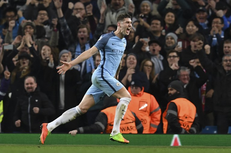 Manchester City's English defender John Stones celebrates scoring their fourth goal during the UEFA Champions League Round of 16 first-leg football match between Manchester City and Monaco at the Etihad Stadium in Manchester, north west England on February 21, 2017. / AFP PHOTO / Paul ELLIS