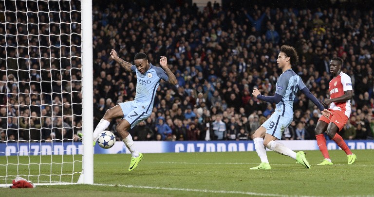 Manchester City's English midfielder Raheem Sterling (L) jumps out of the way as Manchester City's German midfielder Leroy Sane (2R) taps in their fifth goal during the UEFA Champions League Round of 16 first-leg football match between Manchester City and Monaco at the Etihad Stadium in Manchester, north west England on February 21, 2017. / AFP PHOTO / Oli SCARFF