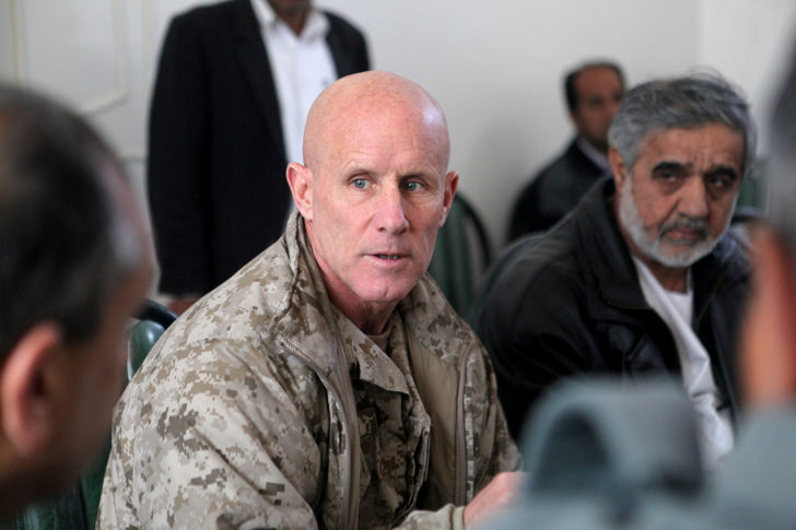 FILE PHOTO - Vice Adm. Robert S. Harward, commanding officer of Combined Joint Interagency Task Force 435, speaks to an Afghan official during his visit to Zaranj, Afghanistan, in this handout photo