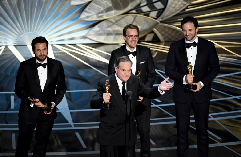 HOLLYWOOD, CA - FEBRUARY 26: Visual effects artists Robert Legato (at microphone) and (L-R) Adam Valdez, Andrew R. Jones, and Dan Lemmon accept Best Visual Effects for 'The Jungle Book' onstage during the 89th Annual Academy Awards at Hollywood & Highland Center on February 26, 2017 in Hollywood, California. Kevin Winter/Getty Images/AFP == FOR NEWSPAPERS, INTERNET, TELCOS & TELEVISION USE ONLY ==