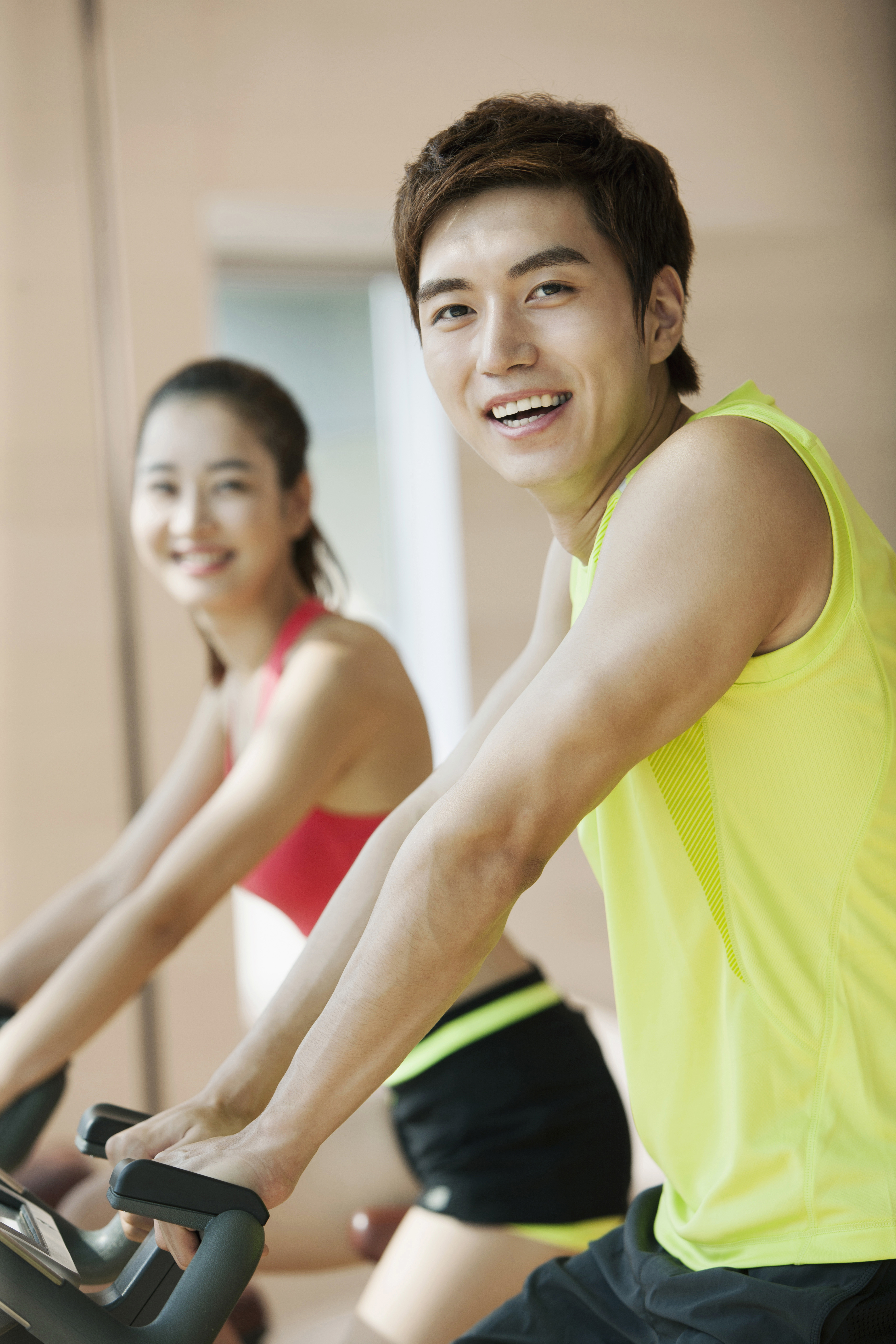 Young people exercising at gym,Korean