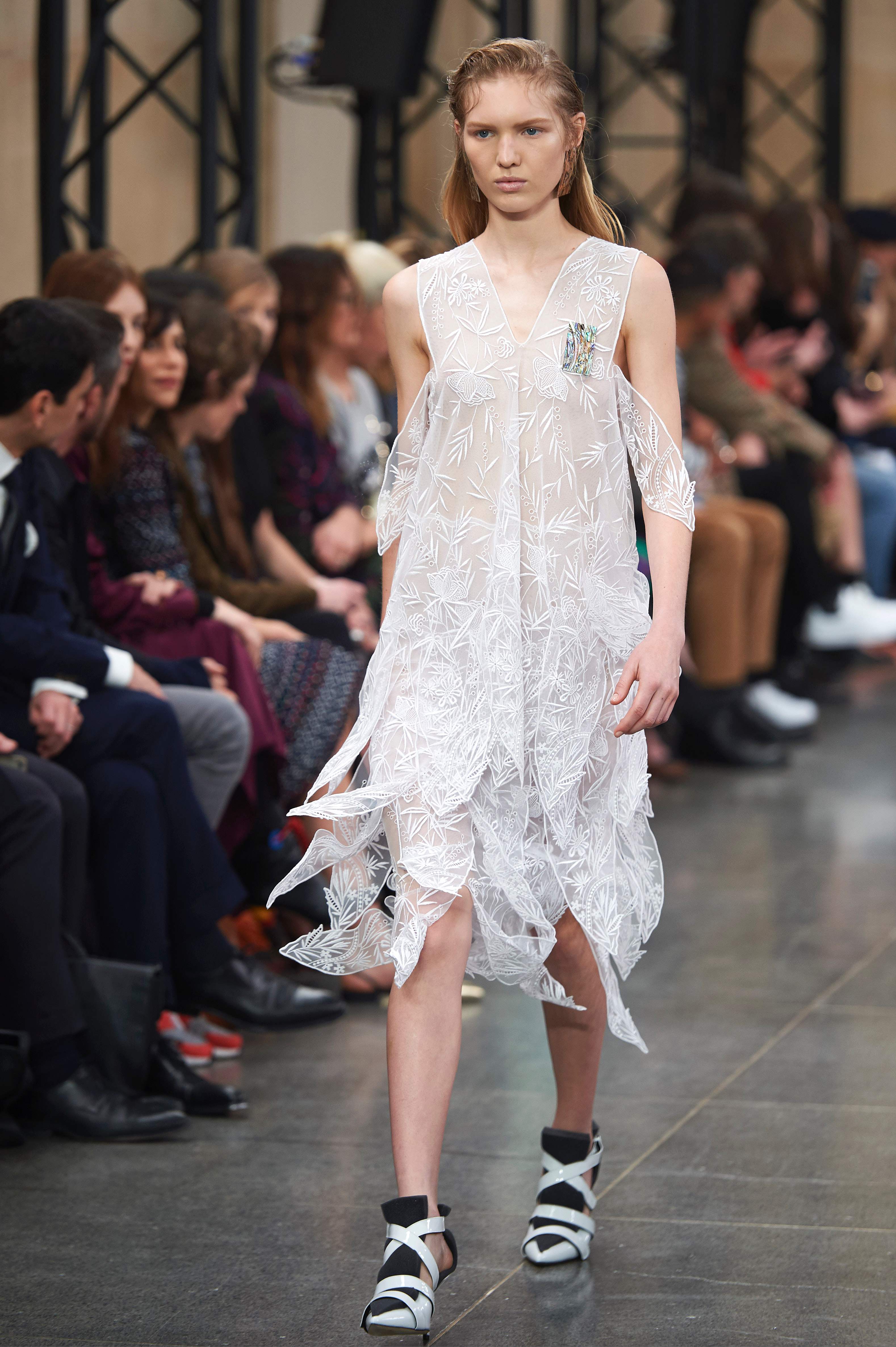 A model presents creations by British fashion designer Christopher Kane during a catwalk show on the fourth day of the Autumn/Winter 2017 London Fashion Week in London on February 20, 2017. / AFP PHOTO / NIKLAS HALLE'N