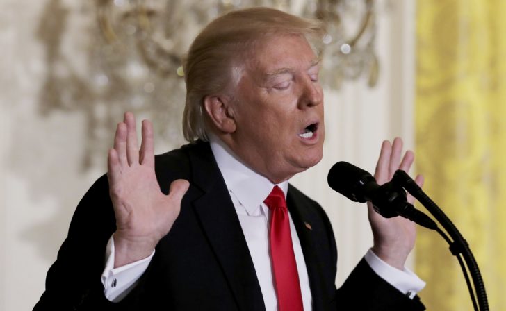 U.S. President Trump reacts to a question during a lengthy news conference at the White House in Washington