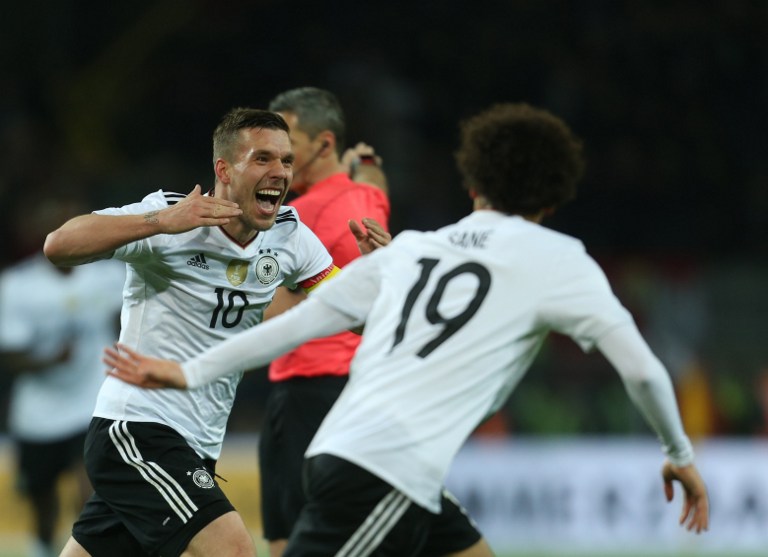Germany's midfielder Lukas Podolski reacts after scoring during a friendly football match between Germany and England on March 22, 2017 in Dortmund, western Germany. It is Lukas Podolski's last match with the German team. / AFP PHOTO / dpa / Ina Fassbender / Germany OUT
