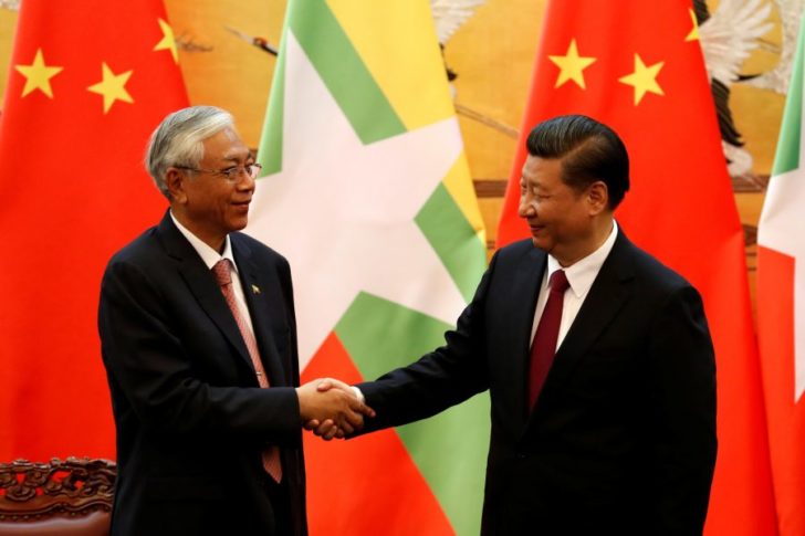 Chinese President Xi Jinping, right, shakes hands with Myanmar's President Htin Kyaw at the Great Hall of People in Beijing