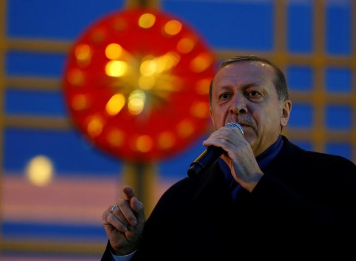 Turkish President Tayyip Erdogan addresses his supporters at the Presidential Palace in Ankara