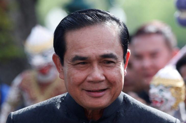 Thailand's Prime Minister Prayuth Chan-ocha smiles as he arrives at a weekly cabinet meeting at the Government House in Bangkok