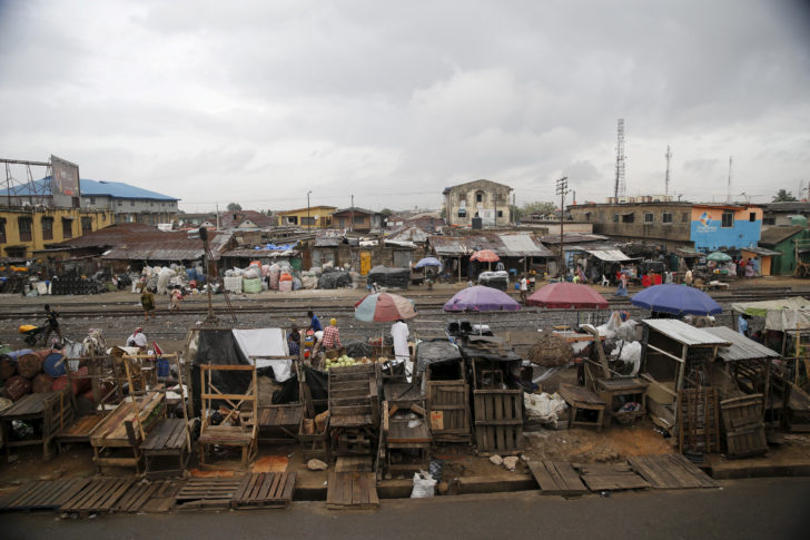 FILE PHOTO: Slum houses are seen built along a train track in the Agege district in Nigeria's commercial capital Lagos