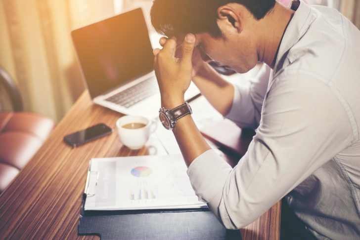 Serious businessman working with analysis financial at office.
