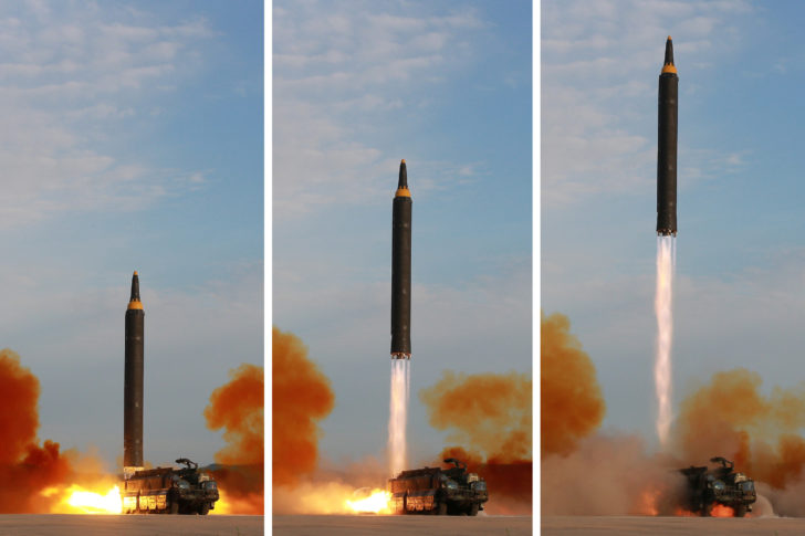 North Korean leader Kim Jong Un guides the launch of a Hwasong-12 missile in this undated combination photo released by North Korea's KCNA