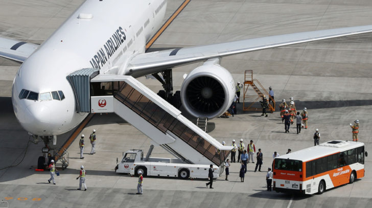 A Japan Airlines plane bound for New York that returned to Tokyo's Haneda airport for an emergency landing due to engine trouble, is seen in Tokyo