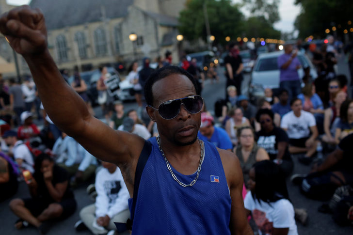 People march through West County Mall after the not guilty verdict in the murder trial of Jason Stockley in St. Louis