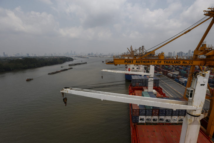 FILE PHOTO: Cargo ships are loaded with containers as they are docked at the port Bangkok