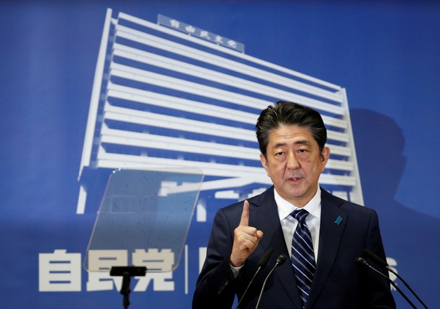 Japan's Prime Minister Shinzo Abe, who is also leader of the Liberal Democratic Party, attends a news conference in Tokyo