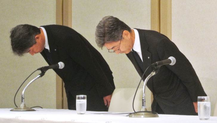 Kobe Steel's executive vice president Naoto Umehara bows his head to apologize at a news conference in Tokyo