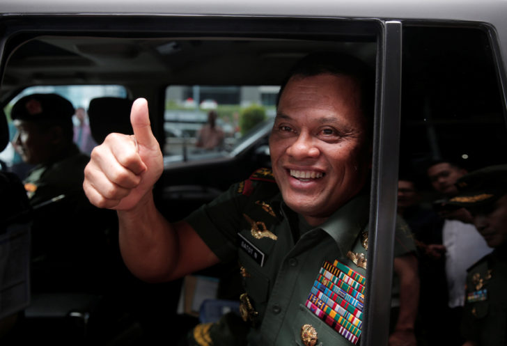 FILE PHOTO: Indonesia's Armed Forces Commander General Gatot Nurmantyo gestures as he sits inside his vehicle after talking to reporters in Jakarta