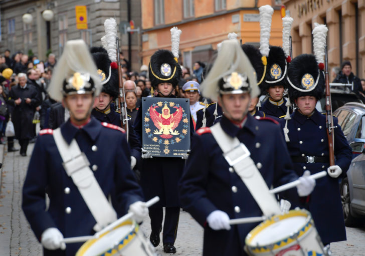 The Coat of Arms of Thailand's late King Bhumibol Adulyadej, as Knight of the Swedish Royal Order of the Seraphim, is carried in a procession to the Riddarholmen church in Stockholm