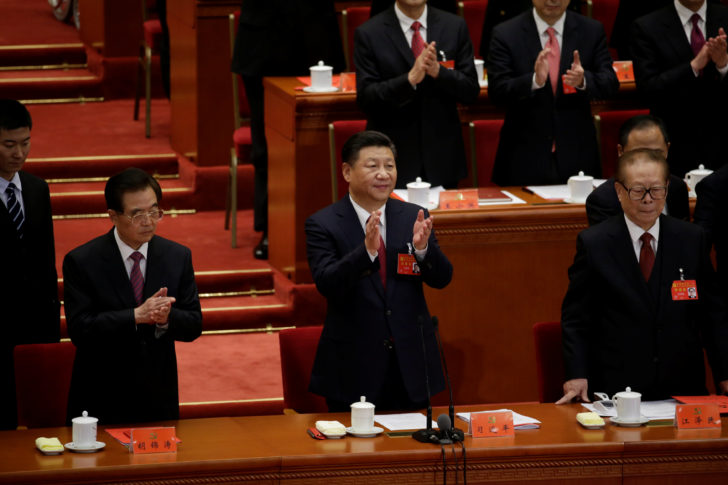 Chinese President Xi Jinping claps after he declares the closing of the 19th National Congress of the Communist Party of China at the Great Hall of the People, in Beijing