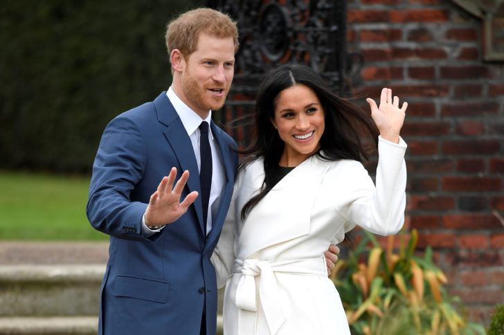 Britain's Prince Harry poses with Meghan Markle in the Sunken Garden of Kensington Palace, London