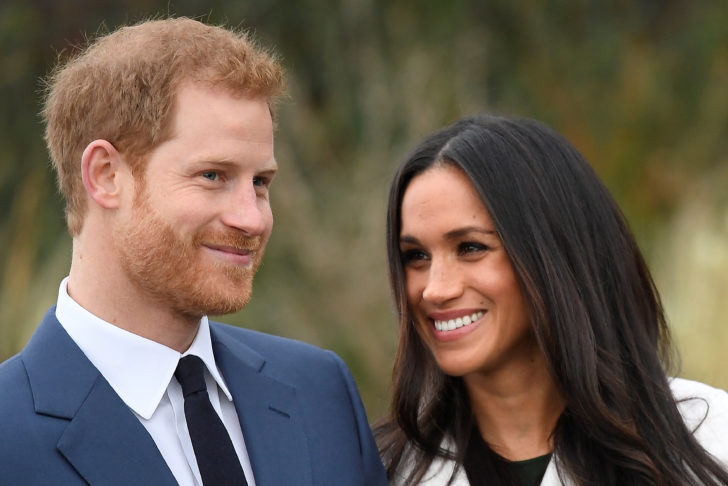 Britain's Prince Harry poses with Meghan Markle in the Sunken Garden of Kensington Palace, London