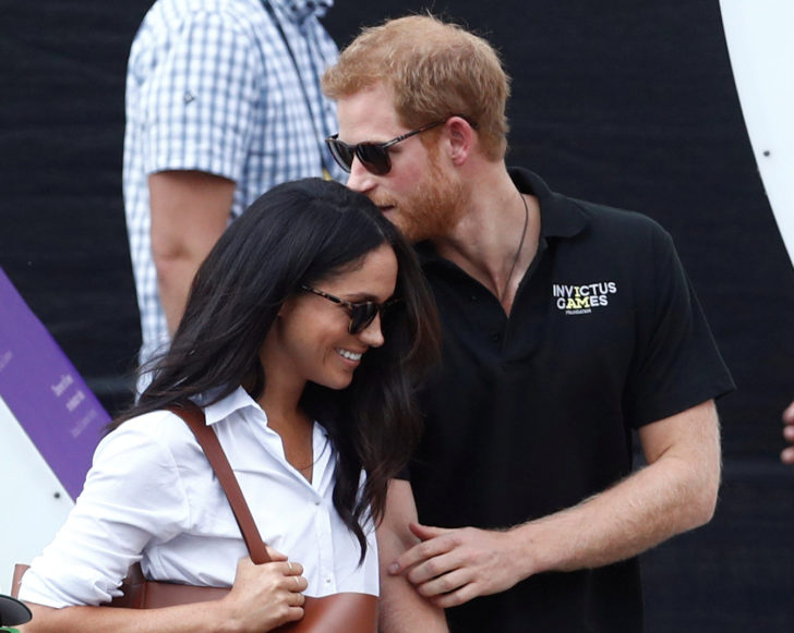 FILE PHOTO: Britain's Prince Harry arrives with girlfriend Markle at the wheelchair tennis event during the Invictus Games in Toronto