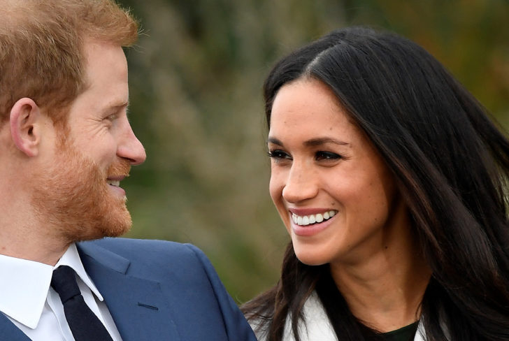 Britain's Prince Harry poses with Meghan Markle in the Sunken Garden of Kensington Palace, London