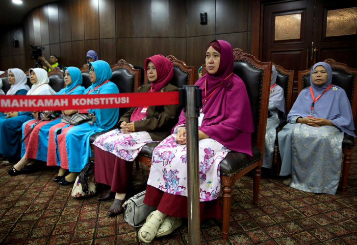 Family Love Alliance members sit as they attend a trial at Indonesia's constitutional court in Jakarta