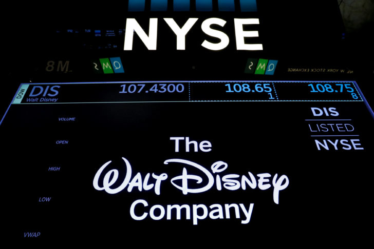 A screen shows the trading info for The Walt Disney Company company on the floor of the NYSE in New York
