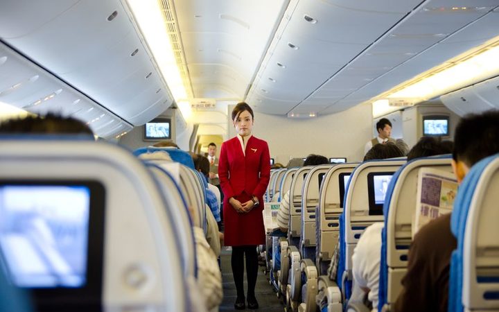 Image result for 1.	Cathay Pacific ends its skirts-only rule for female staff members