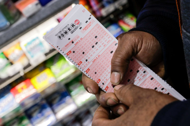 Customer buys tickets for the Powerball lottery in New York City