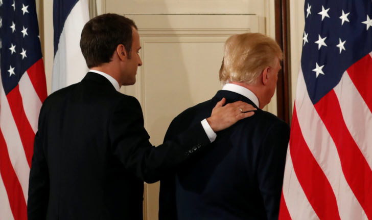 U.S. President Trump and French President Macron depart their news conference at the White House in Washington