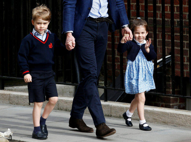 FILE PHOTO: Britain's Prince William arrives at the Lindo Wing of St Mary's Hospital with his children Prince George and Princess Charlotte after his wife Catherine, the Duchess of Cambridge, gave birth to a son, in London