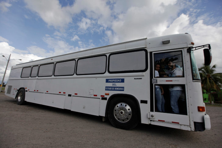 FILE PHOTO: Bus carrying deportees from the U.S. leaves the international airport in San Pedro Sula