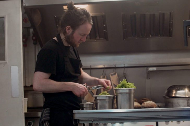 Chef, Douglas McMaster prepares food in the kitchen of Silo, a zero waste restaurant in Brighton, United Kingdom, April 14, 2018. Thomson Reuters Foundation / Cormac O'Brien