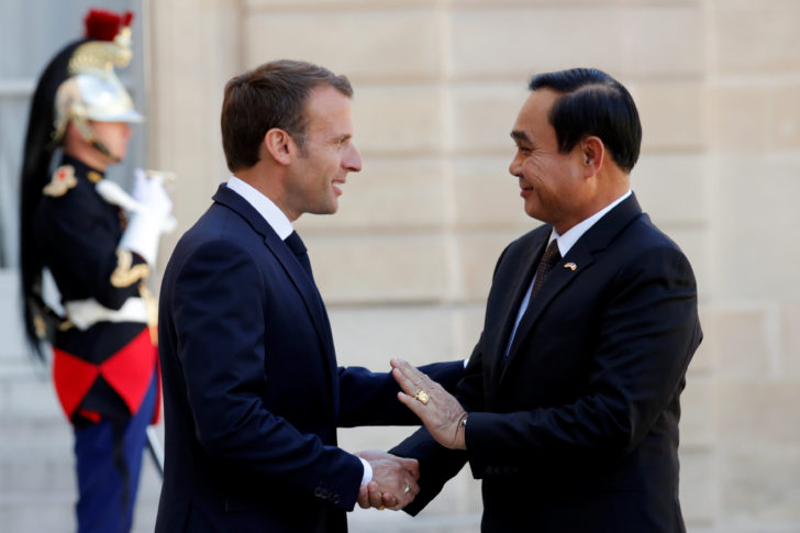 French President Emmanuel Macron welcomes Thailand's Prime Minister Prayuth Chan-o-cha at the Elysee Palace in Paris