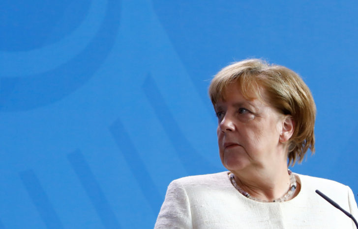 German Chancellor Angela Merkel looks on during a news conference in the chancellery in Berlin, Germany