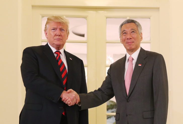 U.S. President Donald Trump and Singapore's Prime Minister Lee Hsien Loong shake hands during a meeting at the Istana in Singapore
