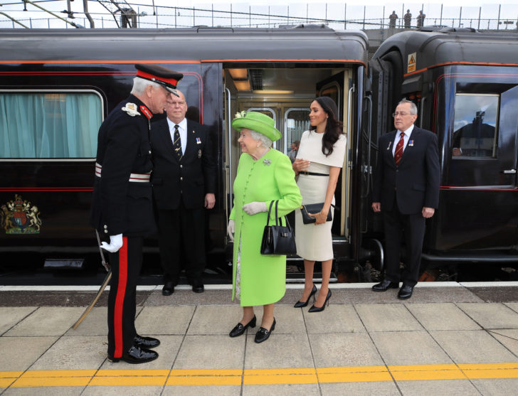 Britain's Queen Elizabeth and Meghan, the Duchess of Sussex, arrive in Runcorn