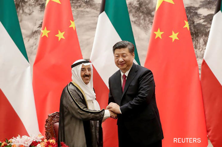 Kuwait's Emir Sheikh Sabah Al-Ahmad Al- Jaber Al-Sabah, left, shakes hands with Chinese President Xi Jinping after witnessing a signing ceremony at the Great Hall of the People in Beijing
