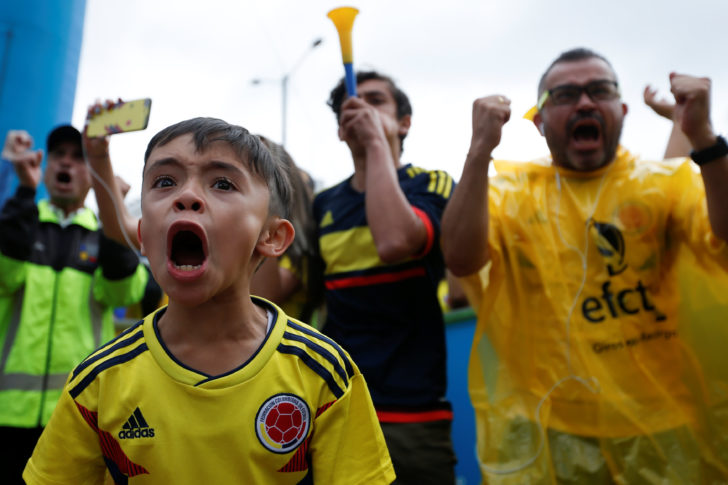 Colombian fans react while watching the broadcast of the World Cup Round of 16 soccer match between Colombia and England in Bogota